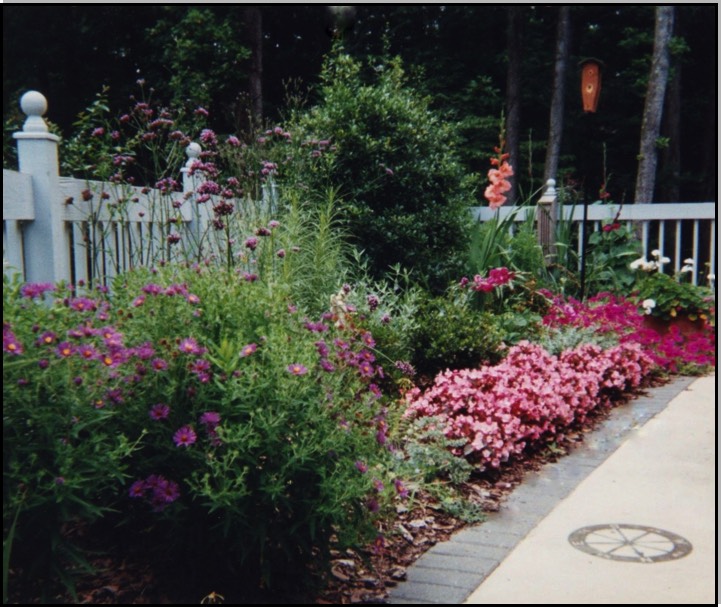 Cottage garden along picket fence